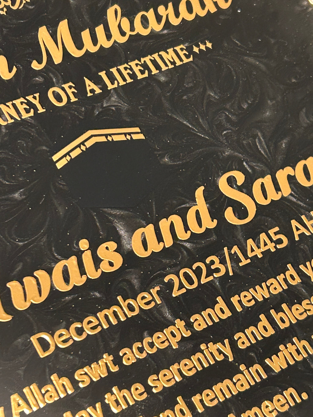 black resin plaque with image of kaaba and gold text