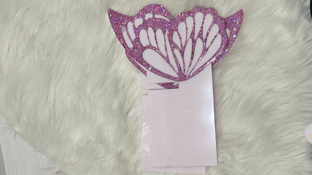 Butterfly-shaped decorative Quran holder stand  with a fluffy white background