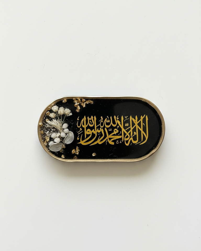 Decorative box with gold calligraphy and floral elements on a white background