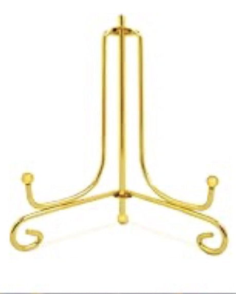 Gold cast iron display stand stand on a white background