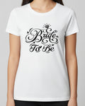 White t-shirt with 'Bride To Be' text in black on a clear background