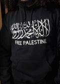Person wearing a black hoodie with 'Free Palestine' text in white