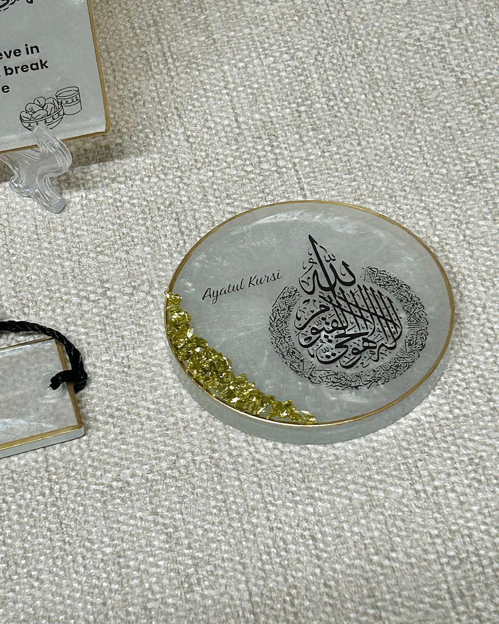 Decorative fridge magnet with Ayatul Kursi Arabic calligraphy on a textured surface