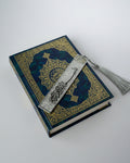 Decorative resin bookmark with Arabic calligraphy and tassel on a light grey background