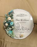 Decorative plate with real floral design and personalised vinyl text on a beige background
