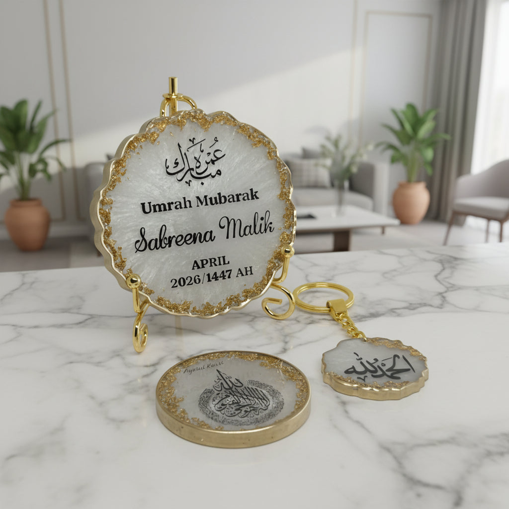Decorative plaque with Arabic text on a marble surface, with a blurred indoor background.